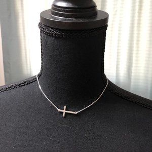 Express fallen cross necklace